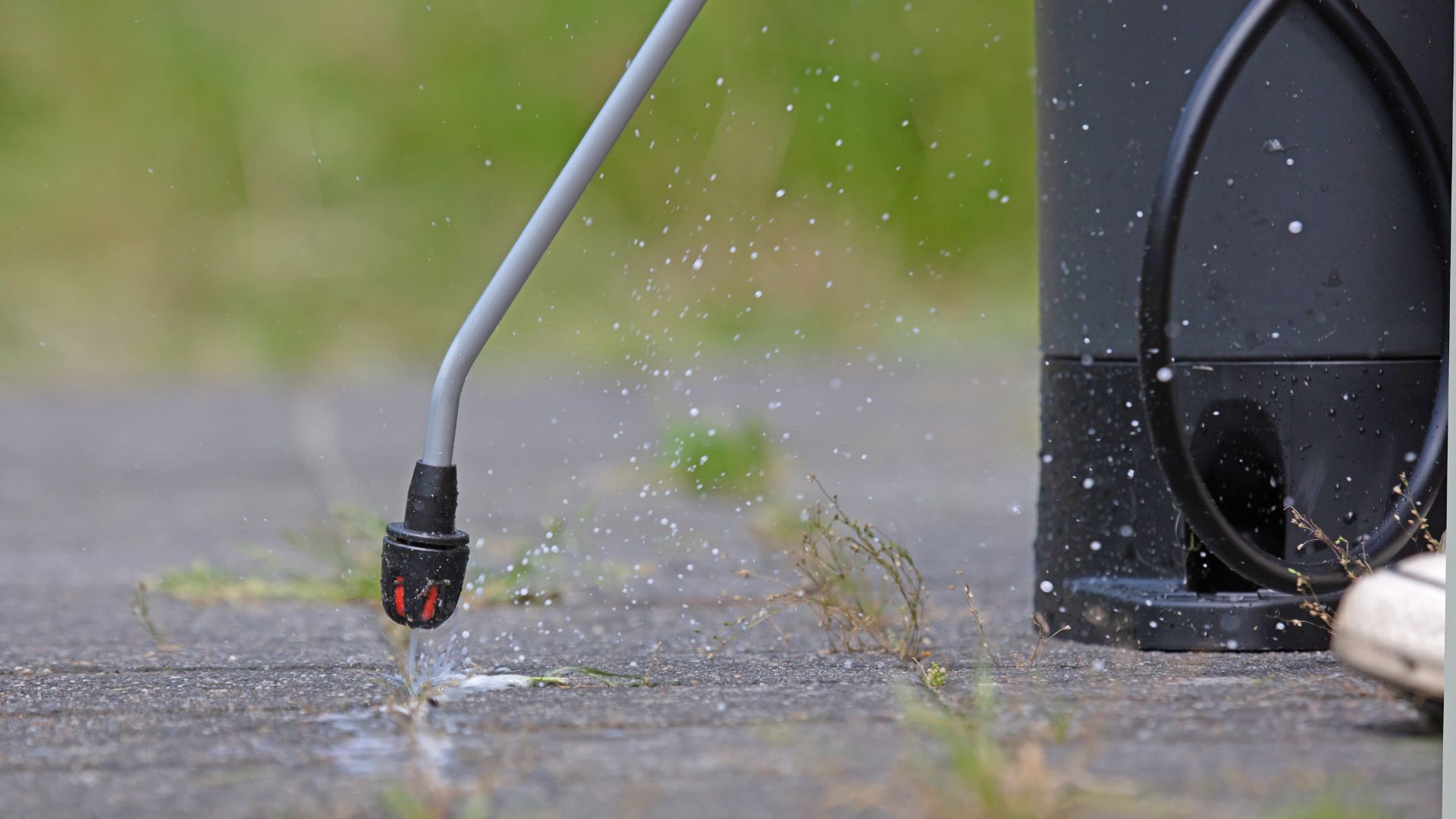 A close up of a person's foot with a water hose attached to a